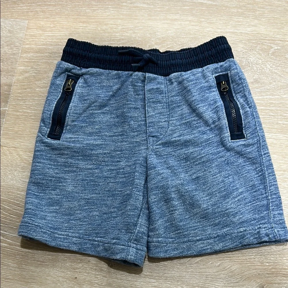 Baby Gap soft blue shorts with zipper pockets accented with dark blue! Size 4